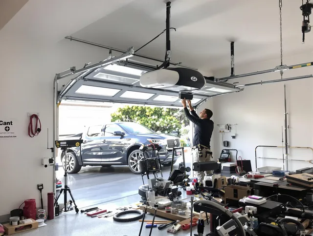 Country Club Garage Door Repair specialist installing smart garage door opener system in Country Club home