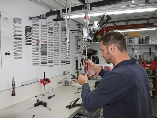 Country Club Garage Door Repair safety certified technician performing precision spring replacement in Country Club