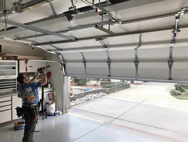 Garage door track repair service by Country Club Garage Door Repair in Country Club